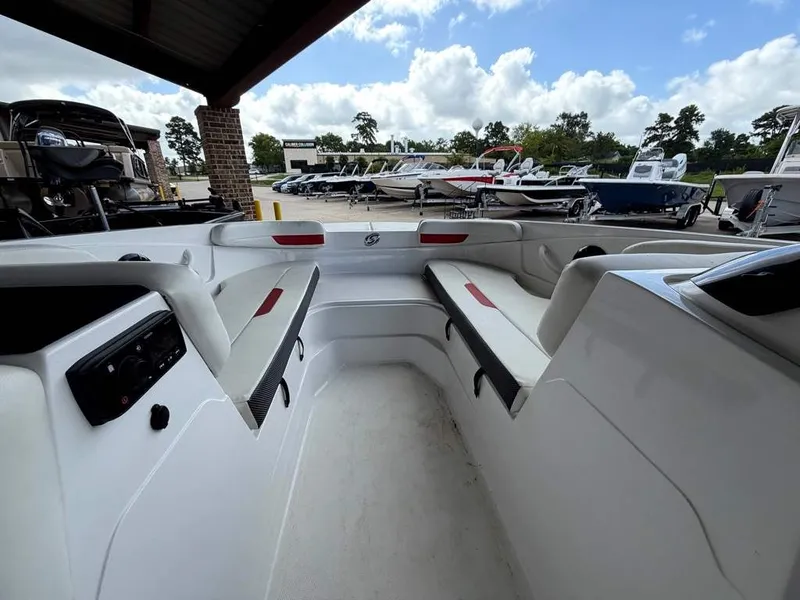 Slide: The Image of The image shows the cockpit of a 2020 Godfrey boat with white seating and red accents. - 14