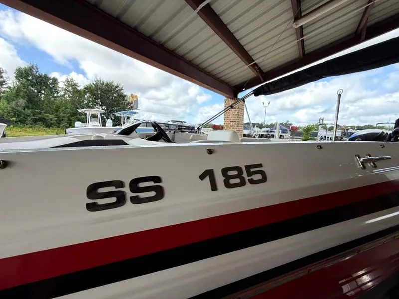 Slide: The Image of A 2020 Godfrey boat, model SS 185, is parked under a covered area. - 6