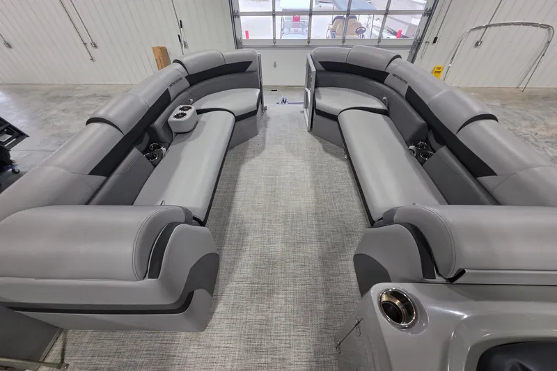 Slide: The Image of Luxurious interior of 2022 South Bay 25 CTS pontoon boat with plush gray seating. - 27