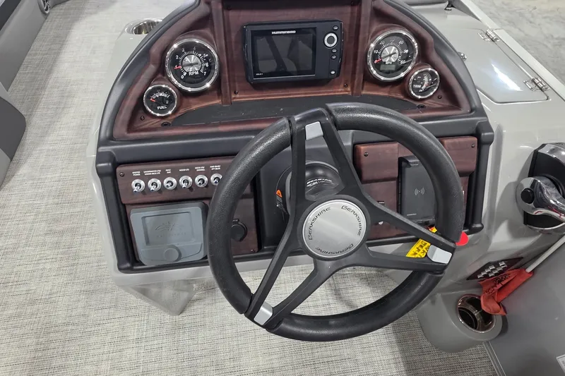 Slide: The Image of Steering console of 2022 South Bay 25 CTS boat with gauges and controls. - 44