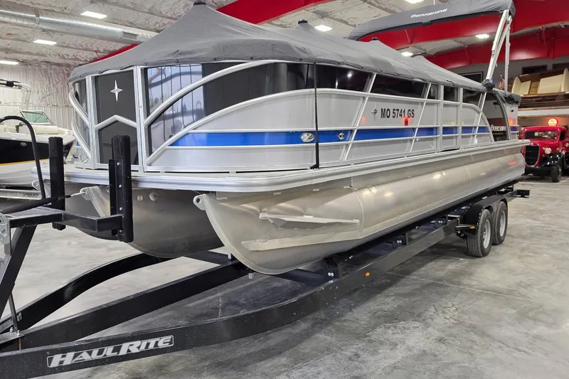 Slide: The Image of 2022 South Bay 25 CTS pontoon boat on trailer in indoor storage facility. - 54
