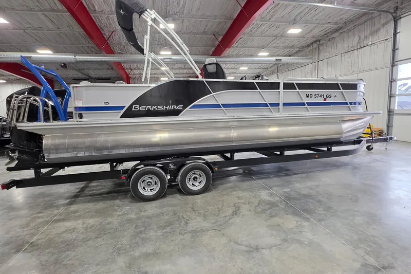 Slide: The Image of 2022 South Bay 25 CTS pontoon boat on trailer in indoor storage facility. - 17