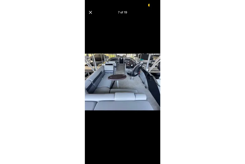 Slide: The Image of 2022 South Bay 25 CTS boat interior with seating and steering wheel. - 7