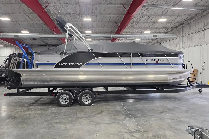 Slide: The Image of 2022 South Bay 25 CTS pontoon boat on trailer in indoor storage facility. - 79