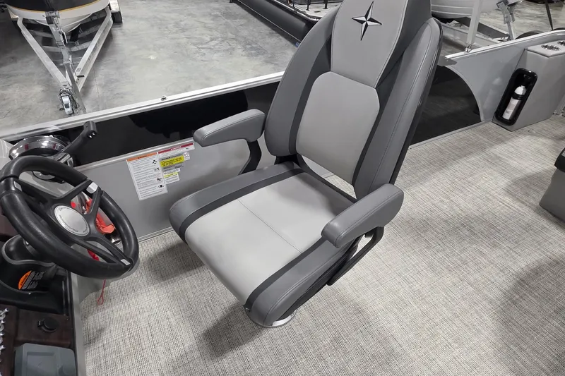 Slide: The Image of Captain's chair in 2022 South Bay 25 CTS pontoon boat, featuring sleek gray upholstery. - 46
