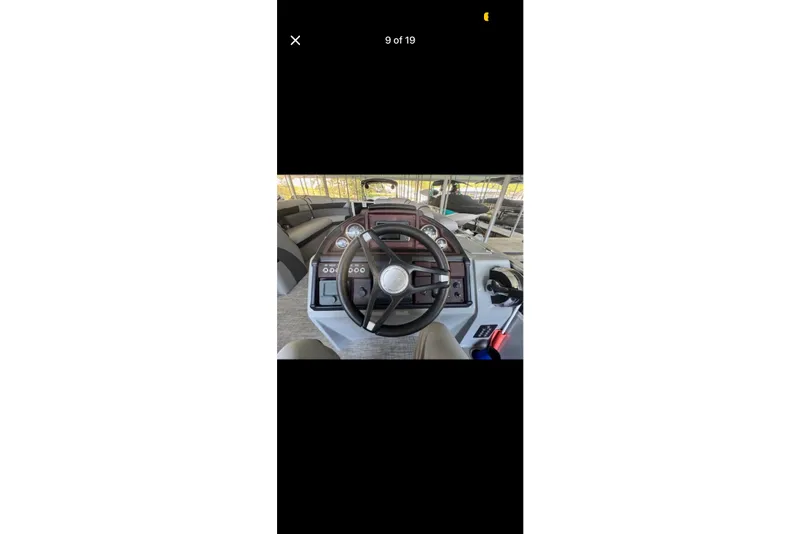 Slide: The Image of Steering console of a 2022 South Bay 25 CTS boat with gauges and controls. - 9