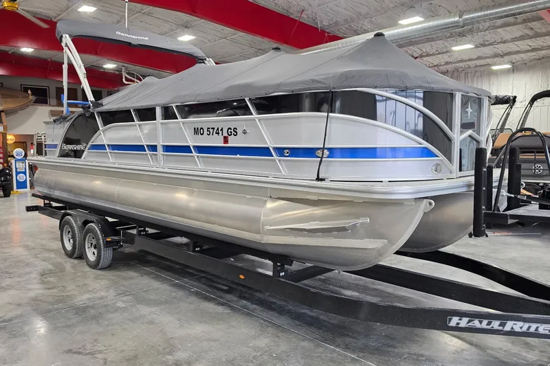 Slide: The Image of 2022 South Bay 25 CTS pontoon boat on trailer in showroom. - 56