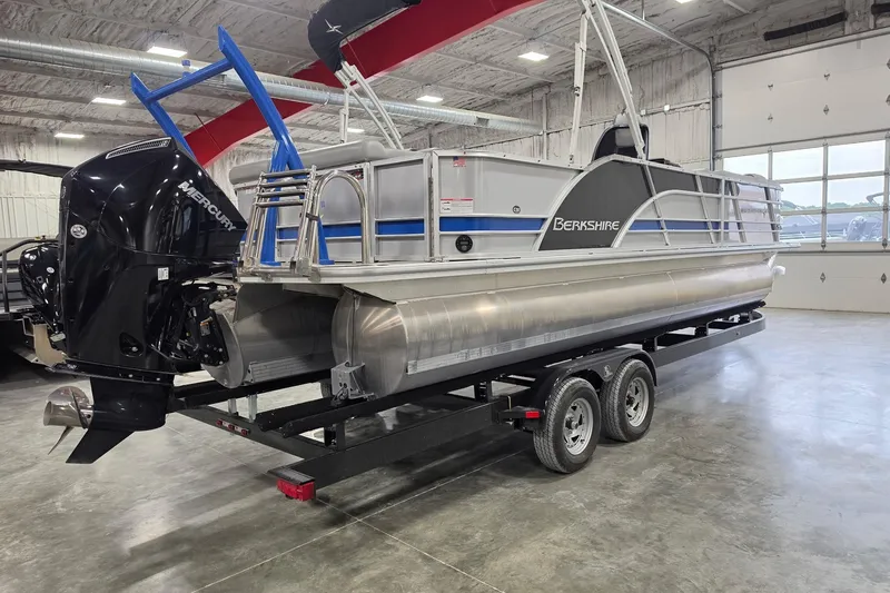 Slide: The Image of 2022 South Bay 25 CTS pontoon boat with Mercury engine on trailer in indoor showroom. - 16