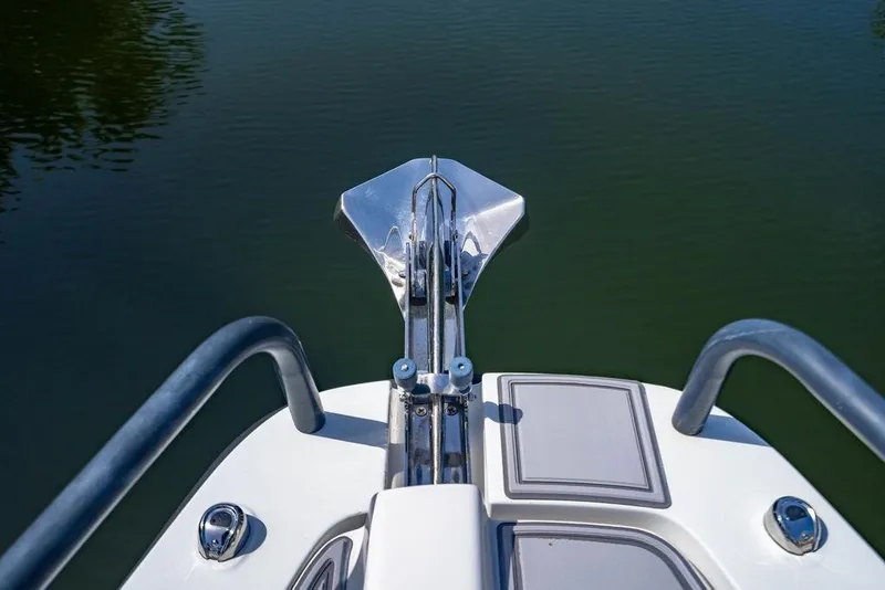 Slide: The Image of Bow view of 2021 Axopar Brabus 37 Sun-Top with anchor over calm water. - 10
