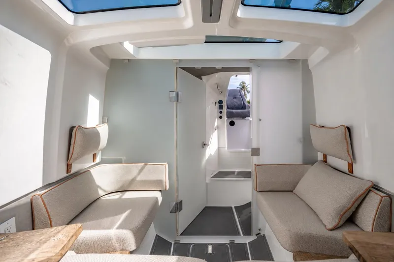 Slide: The Image of Interior of 2021 Axopar Brabus 37 Sun-Top boat with modern seating and skylights. - 27