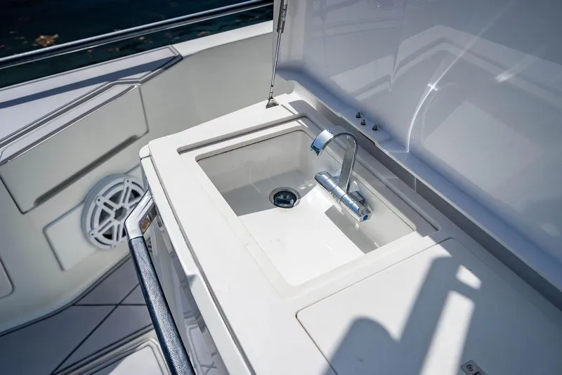 Slide: The Image of Luxury sink on 2021 Axopar Brabus 37 Sun-Top boat, featuring sleek design and modern fixtures. - 20