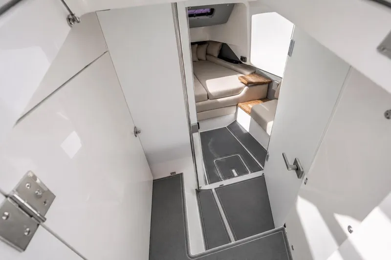 Slide: The Image of Interior cabin of 2021 Axopar Brabus 37 Sun-Top with modern seating and sleek design. - 23