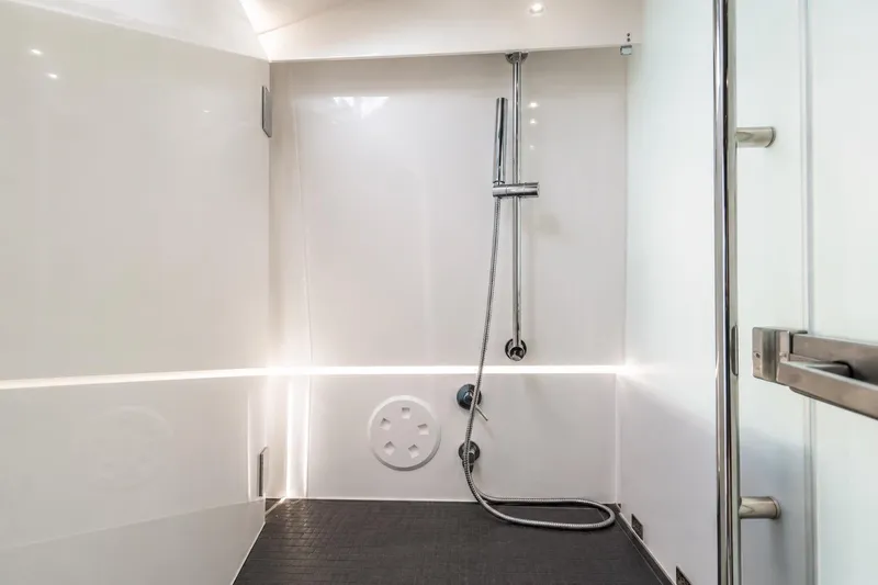 Slide: The Image of Modern shower area in 2021 Axopar Brabus 37 Sun-Top boat, featuring sleek design and fixtures. - 26