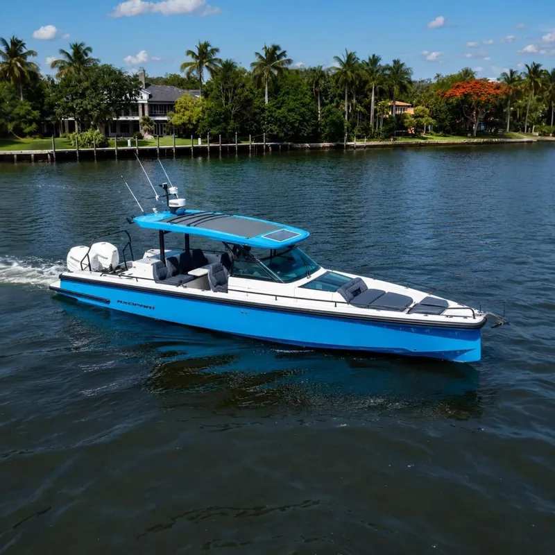 The Image of A blue 2021 Axopar Brabus 37 Sun-Top boat cruising on calm waters. - 0