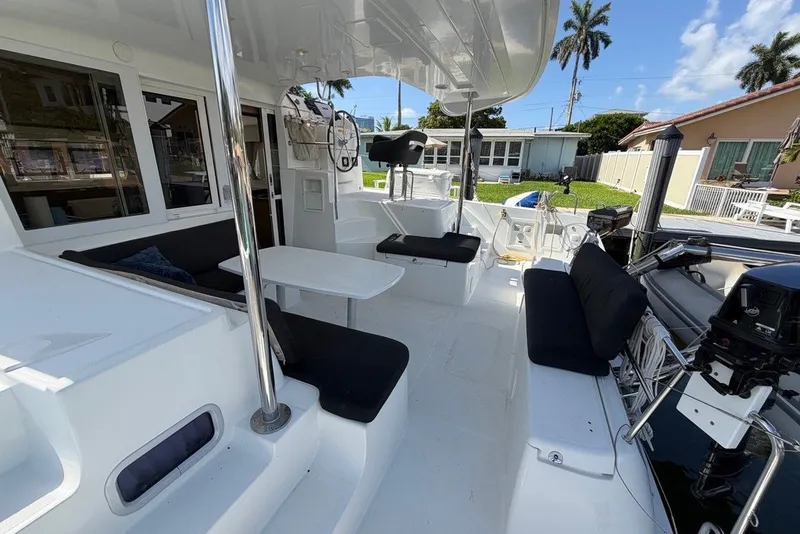 Slide: The Image of Spacious deck of 2020 Lagoon 40 catamaran with seating and helm station. - 27