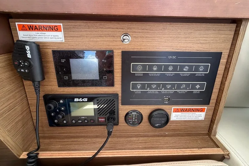 Slide: The Image of Control panel of a 2020 Lagoon 40 yacht with B&G equipment and warning labels. - 12
