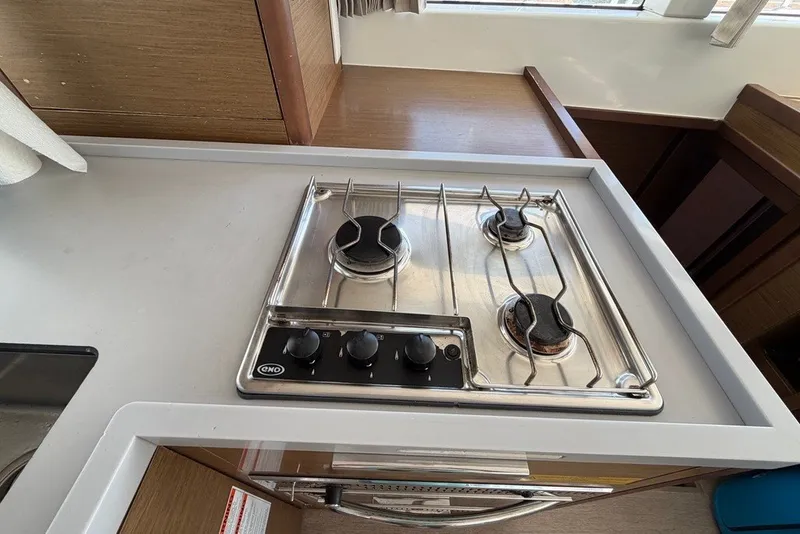 Slide: The Image of Modern kitchen stove on 2020 Lagoon 40 catamaran, featuring a sleek three-burner design. - 11