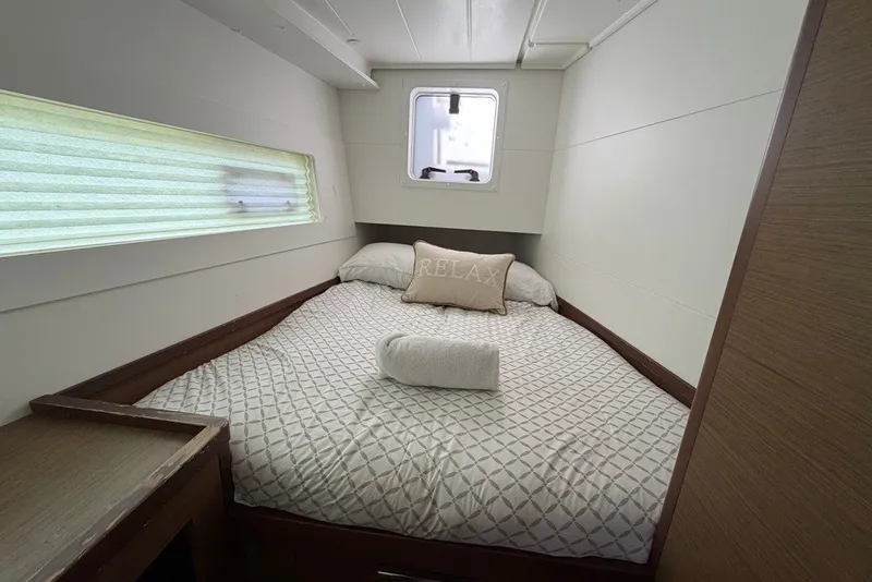 Slide: The Image of Cozy bedroom in 2020 Lagoon 40 catamaran with window and relaxing decor. - 22
