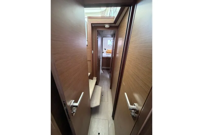 Slide: The Image of Interior hallway of 2020 Lagoon 40 catamaran with wooden finish and modern design. - 23
