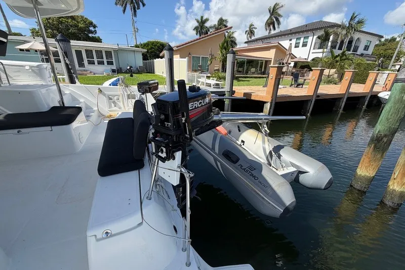 Slide: The Image of 2020 Lagoon 40 catamaran docked with inflatable dinghy and outboard motor. - 34