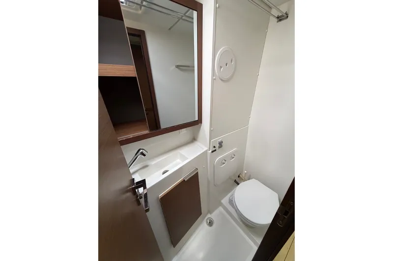 Slide: The Image of Compact bathroom in 2020 Lagoon 40 catamaran with sink, toilet, and mirror. - 17