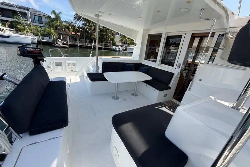 Slide: The Image of Spacious deck of 2020 Lagoon 40 catamaran with comfortable seating and table. - 25