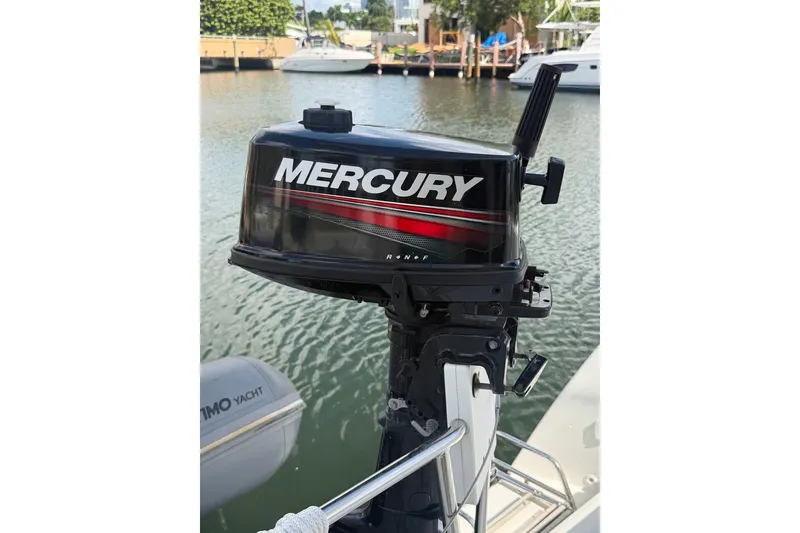 Slide: The Image of Outboard Mercury motor on a 2020 Lagoon 40 catamaran, docked by the water. - 36