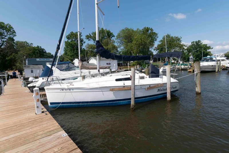 The Image of 2013 Marlow-Hunter 27 sailboat docked at a marina on a sunny day. - 0