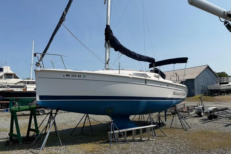 Slide: The Image of 2013 Marlow-Hunter 27 sailboat on stands in a boatyard, ready for maintenance. - 2