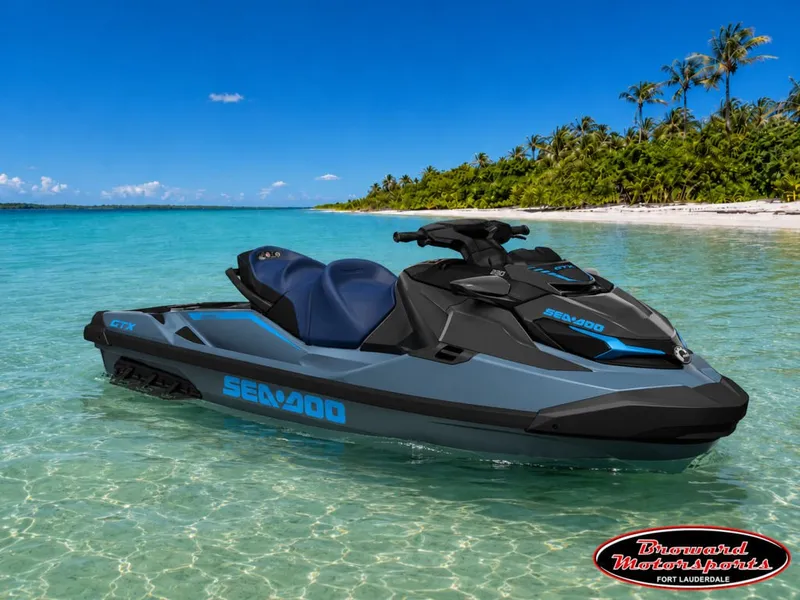 Slide: The Image of A 2026 Sea-Doo GTX 230 jet ski floats in clear turquoise water near a tropical island. - 2