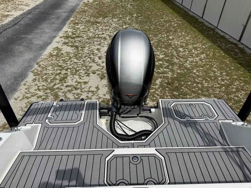 Slide: The Image of The image shows the stern of a Starcraft SVX 211 OB with an outboard motor. - 10