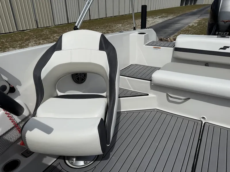 Slide: The Image of A modern boat seat with gray and white upholstery, surrounded by gray flooring. - 8