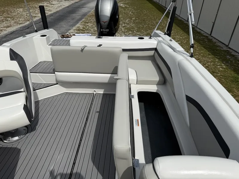 Slide: The Image of The image shows the cockpit of a 2023 Starcraft SVX 211 OB with gray flooring and white upholstery. - 9