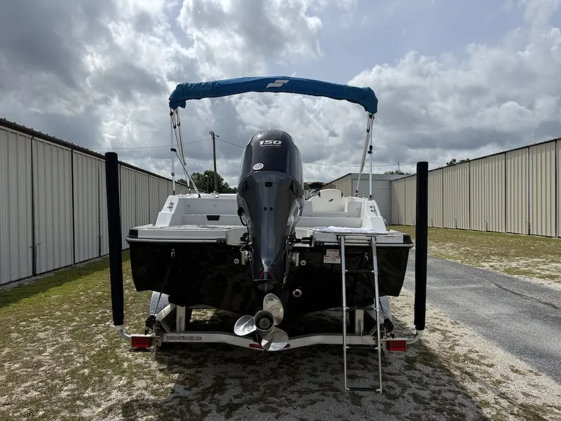 Slide: The Image of The image shows a 2023 Starcraft SVX 211 OB boat with an outboard motor. - 2