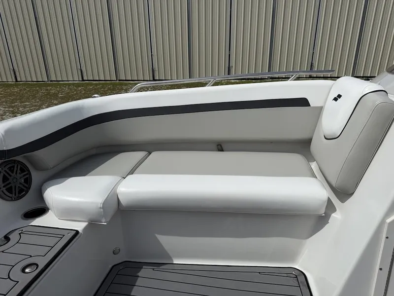 Slide: The Image of The 2023 Starcraft SVX 211 OB features a sleek white bench seat with gray accents. - 13