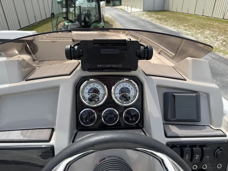Slide: The Image of The dashboard of a 2023 Starcraft SVX 211 OB with multiple gauges and a steering wheel. - 7