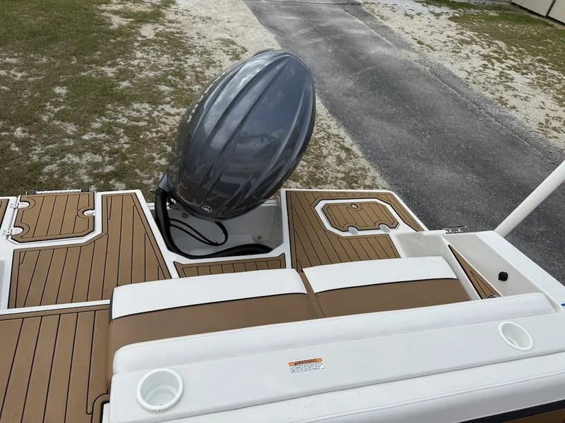 Slide: The Image of The image shows the stern of a Starcraft SVX 231 OB with an outboard motor. - 22