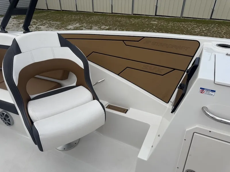 Slide: The Image of A modern boat with a white seat and brown accents. It features a sleek design. - 14
