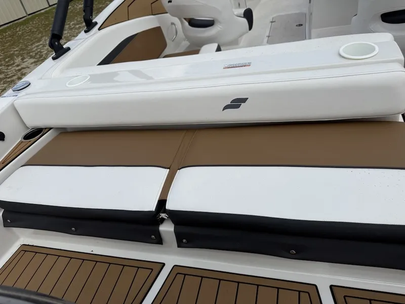 Slide: The Image of The image shows the seating of a 2025 Starcraft SVX 231 OB boat with brown and white upholstery. - 21