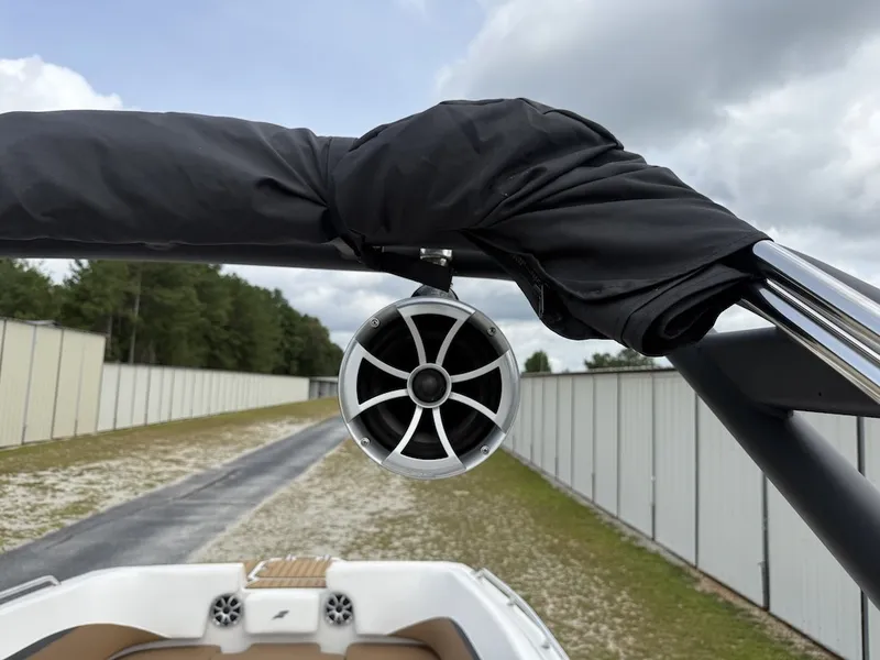 Slide: The Image of A speaker is mounted on a black roll bar of a Starcraft SVX 231 OB boat. - 23