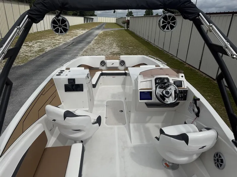 Slide: The Image of The image shows the cockpit of a 2025 Starcraft SVX 231 OB with modern seating and controls. - 6