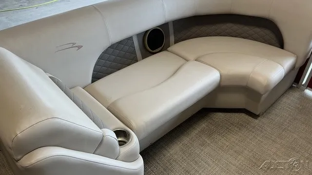 Slide: The Image of The interior of a 2018 Bennington 22 SLX TRI-LOG S CRUISE PREMIUM features elegant, upholstered seating. - 7