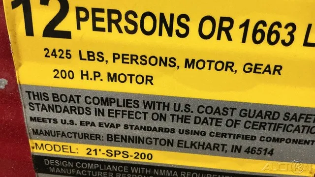 Slide: The Image of Capacity sign: 12 persons or 1663 kg, 200 HP motor. Manufacturer: Bennington Elkhart, IN. - 13
