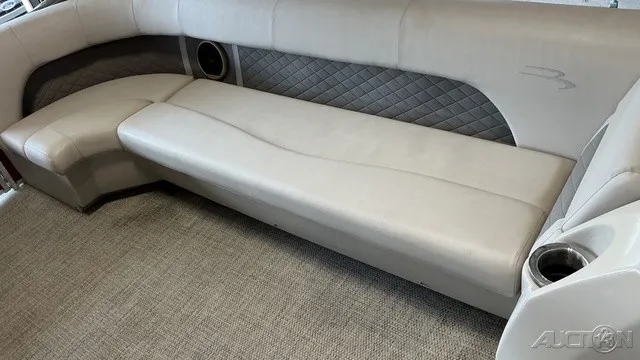 Slide: The Image of Interior of a Bennington 22 SLX TRI-LOG S CRUISE PREMIUM with cushioned seating and a cup holder. - 6