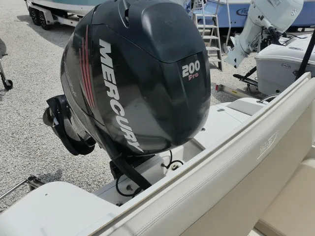 Slide: The Image of A Mercury 200 Pro outboard motor is mounted on a Boston Whaler 210 Dauntless boat. - 4