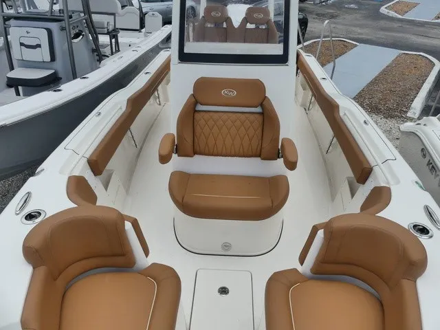 Slide: The Image of The image shows the cockpit of a Key West 249 FS boat with brown leather seats. - 15