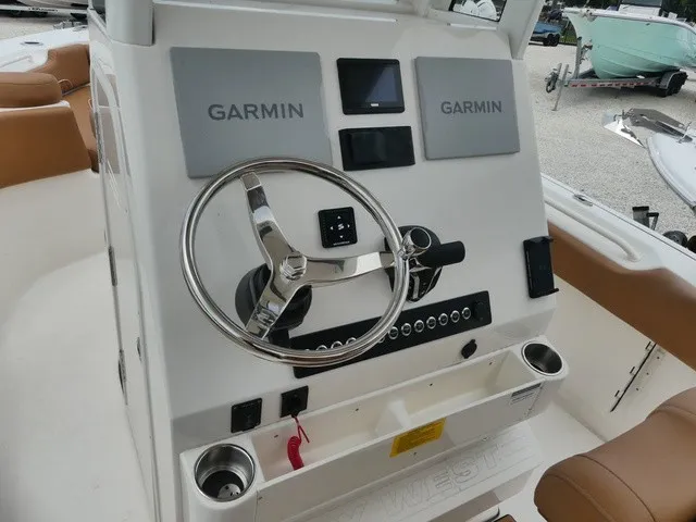 Slide: The Image of The image shows the helm of a Key West 249 FS boat with Garmin electronics. - 9