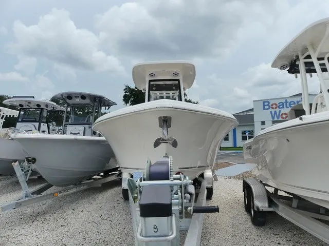 Slide: The Image of A 2026 Key West 249 FS boat on a trailer, surrounded by other boats. - 2