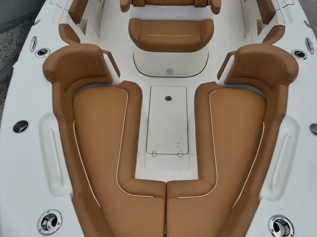 Slide: The Image of The image shows the cockpit of a Key West 249 FS boat with brown upholstery. - 16