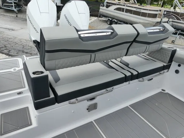 Slide: The Image of The 2027 Monterey Elite 30 OB features stylish gray upholstery and two Mercury outboard engines. - 8